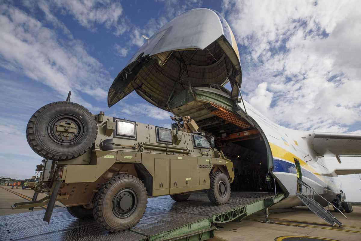 An Australian Government-donated Bushmaster protected mobility vehicle is loaded onto an Antonov AN-124 cargo aircraft at RAAF Base Amberley in Queensland.