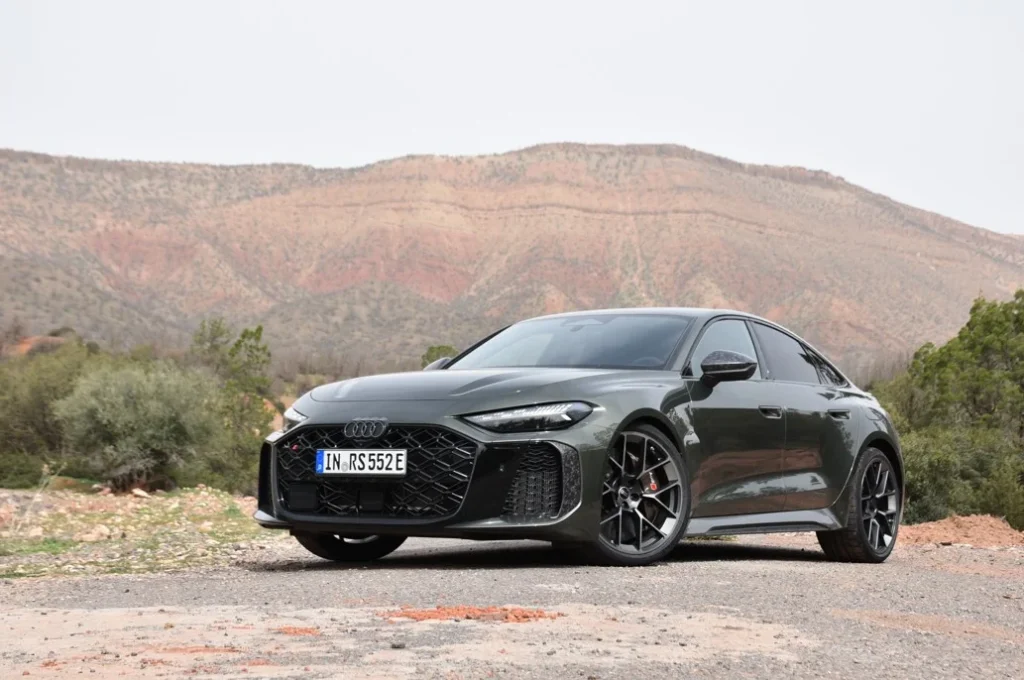 The new Audi RS5 features a steering wheel button for a performance boost from its 630 hp hybrid engine, delivering an incredible and refined driving experience