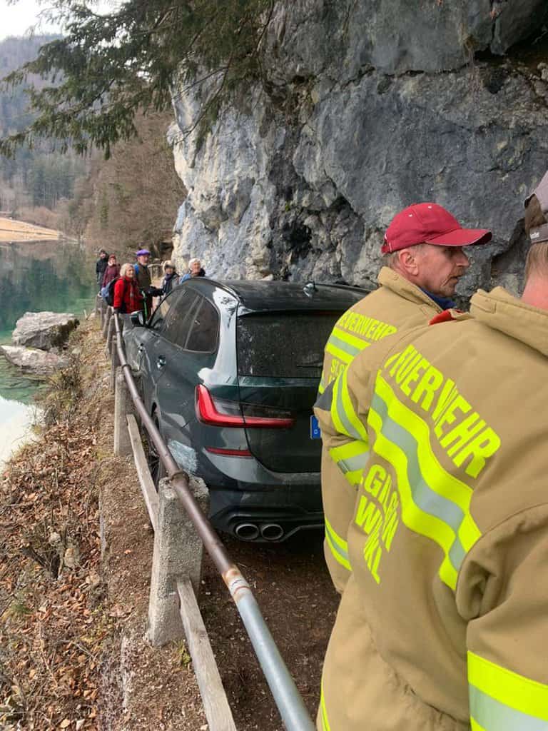 BMW driver gets car stuck on hiking trail 