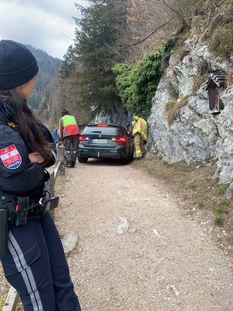 Rescue operation after BMW driver gets car stuck on hiking trail