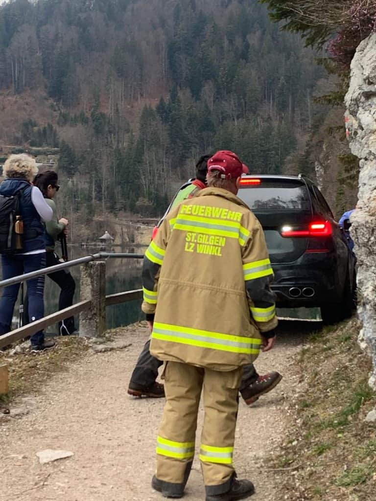 Firefighters free the car after it gets stuck on hiking trail