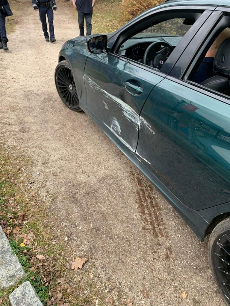 BMW driver scratches car on railing