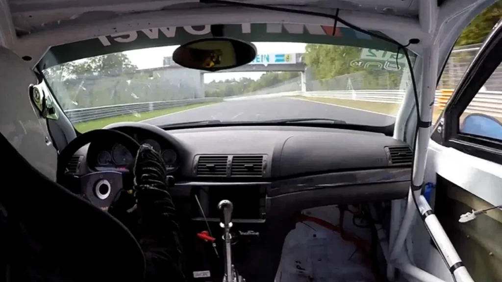 Man driving BMW E46 M3 race car loses a door at 173mph on the Nürburgring and has a very casual reaction of disbelief