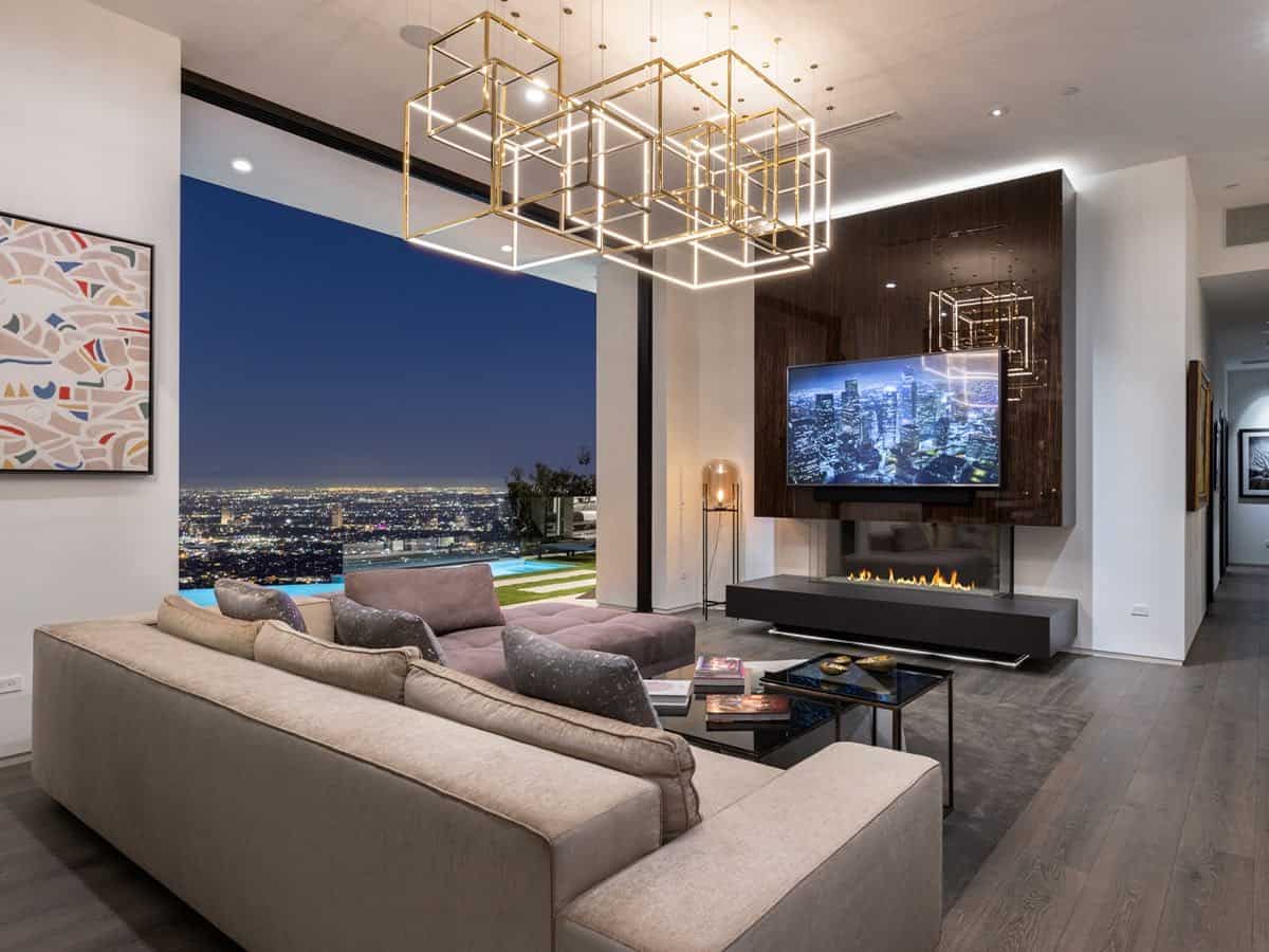 The living room overlooks the city lights of LA.