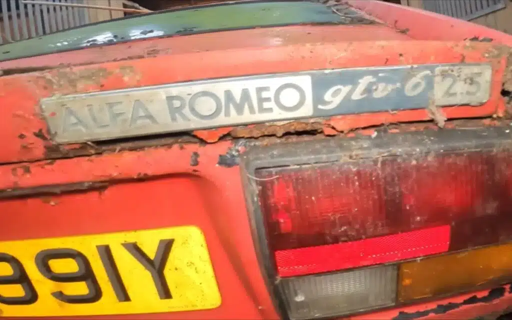 Barn likely used for horses in abandoned farm holds two Alfa Romeo gems parked for about 20 years