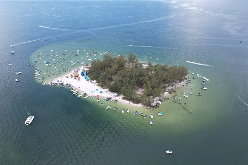 Four friends pooled money together to buy deserted Florida island for $65,000 and transformed into a paradise worth $14M with an iconic name