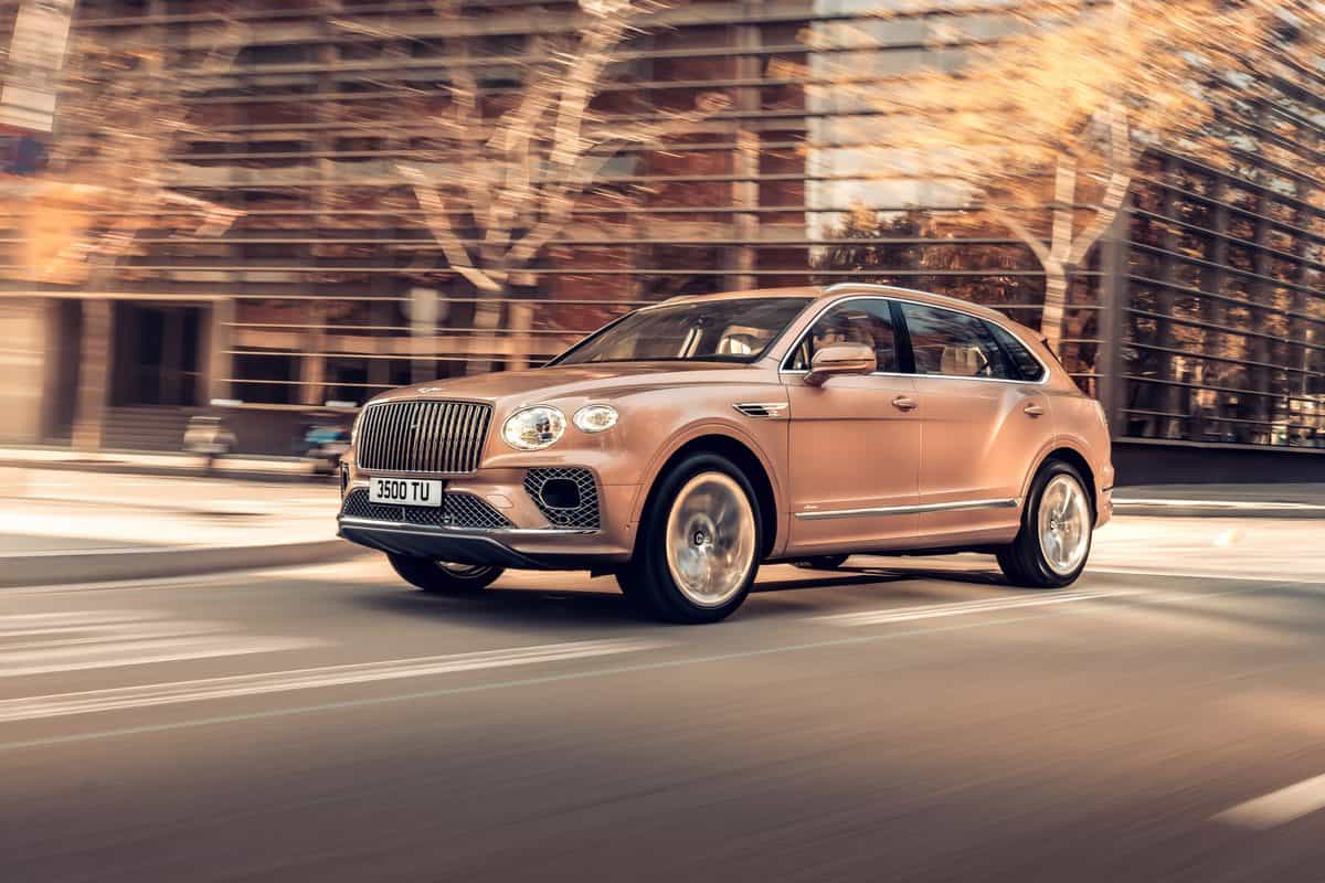 The Bentley Bentayga in motion on the street.