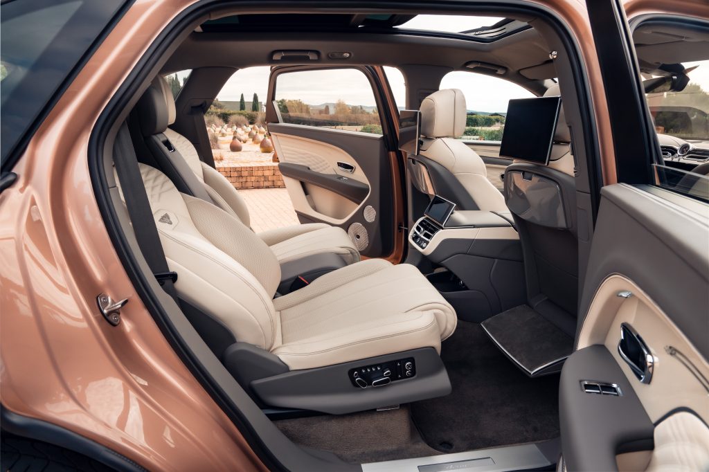 The doors open on the Bentley, giving you a view of the interior.