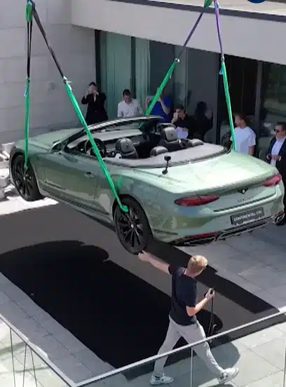 $420k Bentley craned to rooftop of Michelin-starred chef's restaurant for unique dining experience