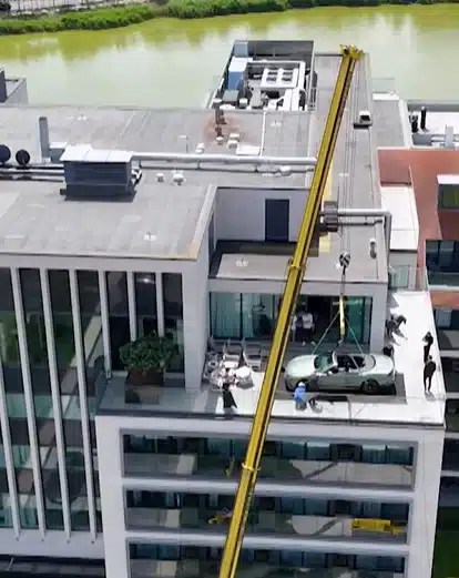 $420k Bentley craned to rooftop of Michelin-starred chef's restaurant for unique dining experience
