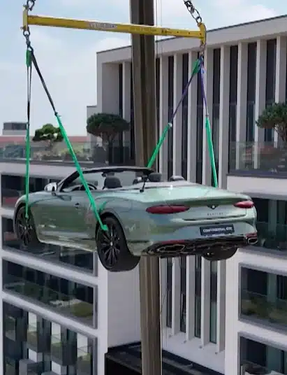 $420k Bentley craned to rooftop of Michelin-starred chef's restaurant for unique dining experience