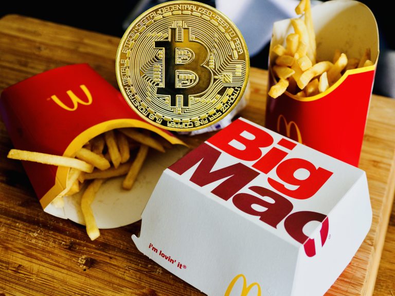 Big Mac and McDonald's fries with bitcoin logo
