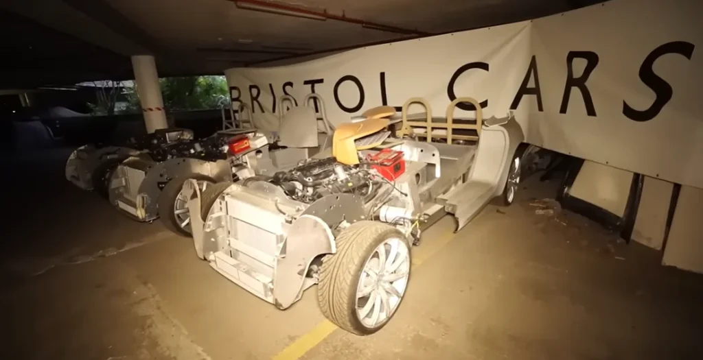 Guys dropped from great height to get into secret underground facility and in there found valuable car hoard that included an F1 car