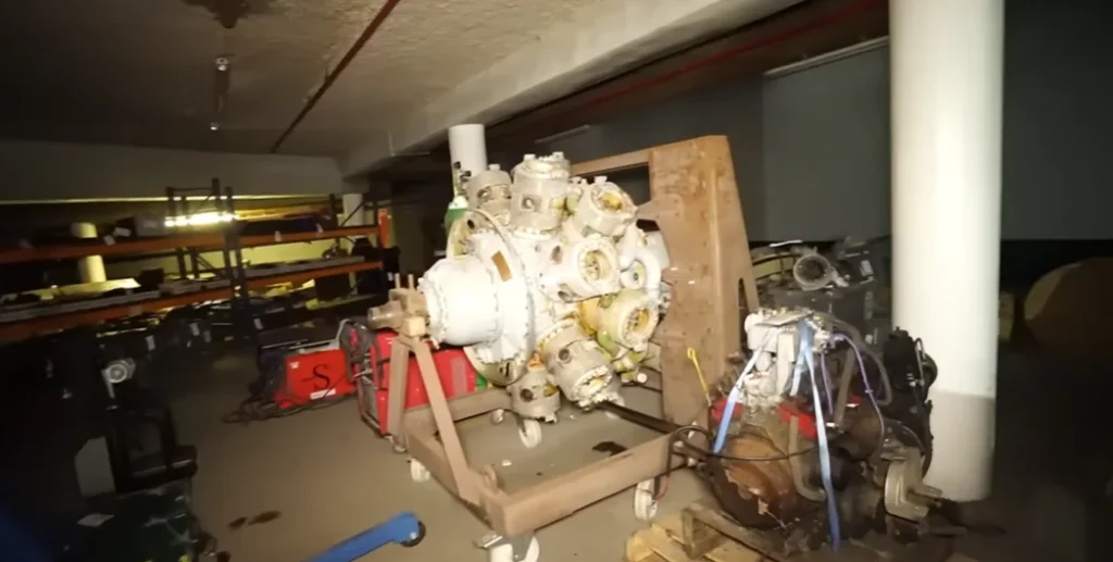 Guys dropped from great height to get into secret underground facility and in there found valuable car hoard that included an F1 car