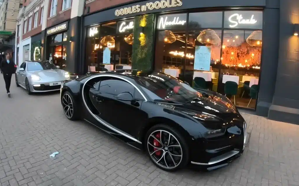 POV drive of a Bugatti Chiron through a city center