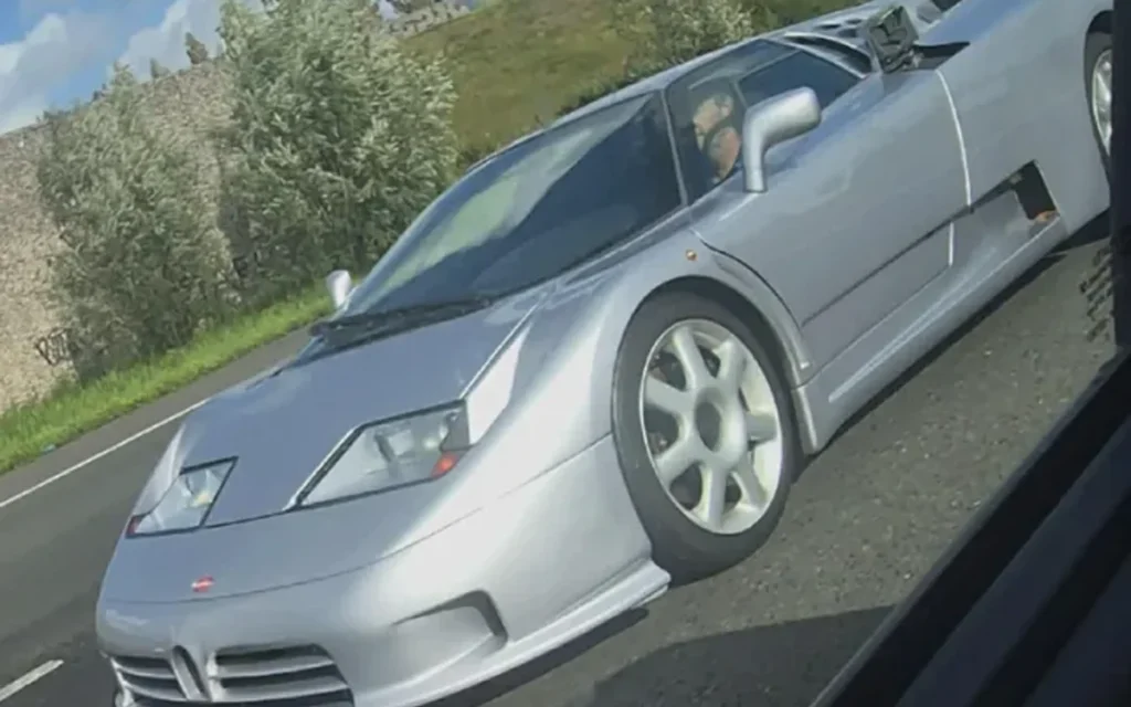 A classic Bugatti EB110 was spotted on a highway in the Netherlands, but one feature left fellow drivers laughing at the rare supercar