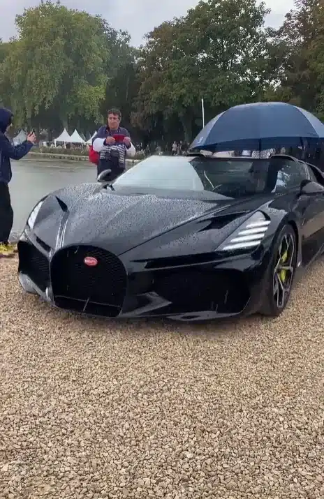 This Bugatti was made for sunshine but someone took it out with a umbrella instead