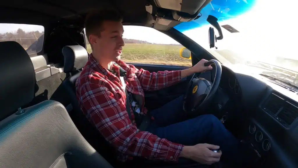 Tyler in his Ferrari car