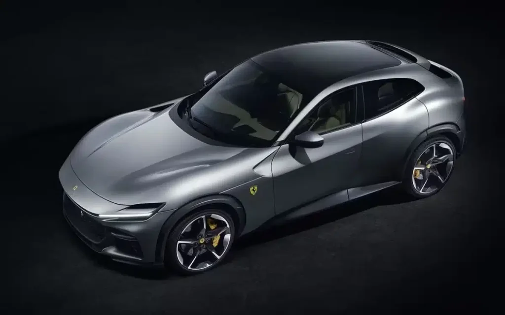 Zlatan Ibrahimovic stands on top of nearly $10,000,000 worth of Ferrari supercars as he shows off his unreal collection