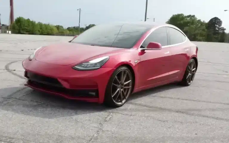 Man restores a salvage Tesla then surprises his wife with it as her new car and her reaction is one of disbelief