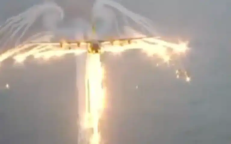 C-130 Hercules releases its flares to make smoke angel in incredible footage