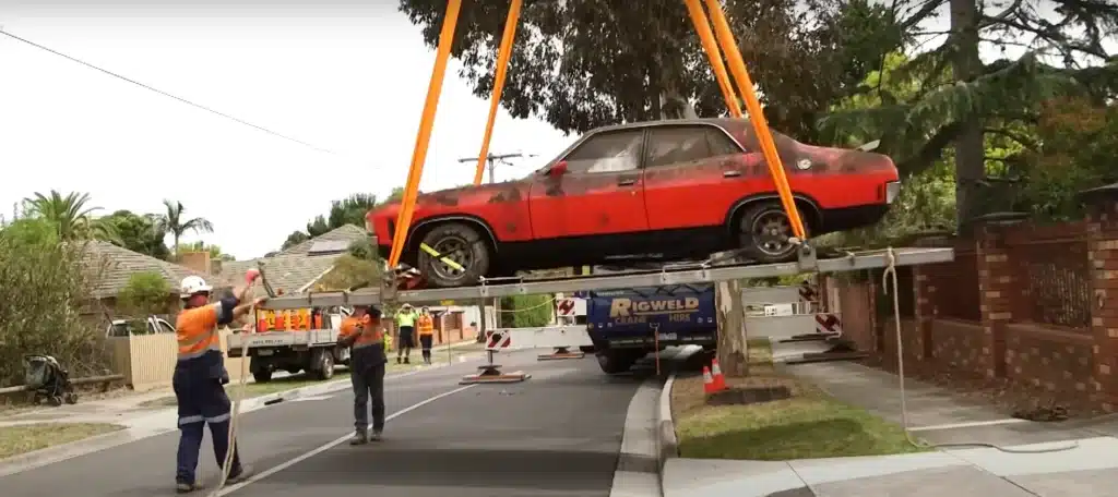 Rare muscle car stored for three decades needed to be craned 30 feet up in the air to be saved