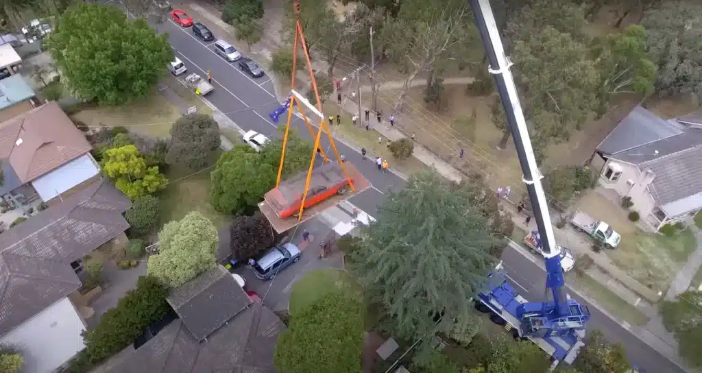 Rare muscle car stored for three decades needed to be craned 30 feet up in the air to be saved