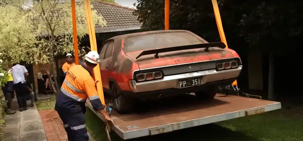 Rare muscle car stored for three decades needed to be craned 30 feet up in the air to be saved