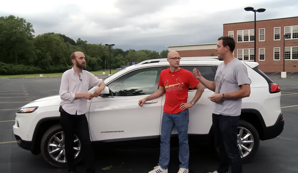 Man drives a Jeep down a highway while two hackers remotely attack it from miles away to show what the experience is like