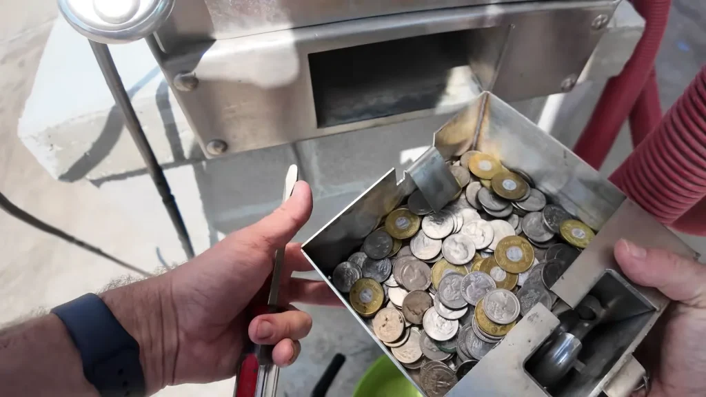 Oklahoma man who bought a car wash collects his first full month of cash from the vending machine as he reveals exceptional profit he's set to make in first year