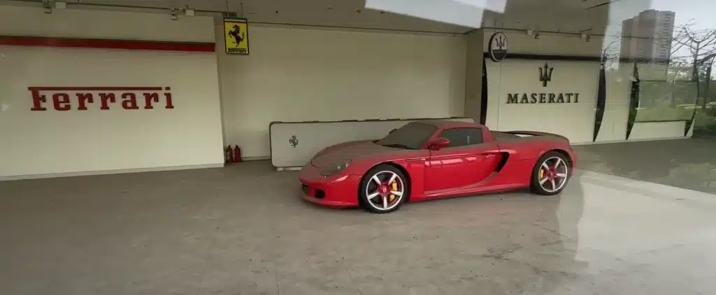 Incredibly rare Porsche Carrera GT left rotting away in abandoned China car dealership