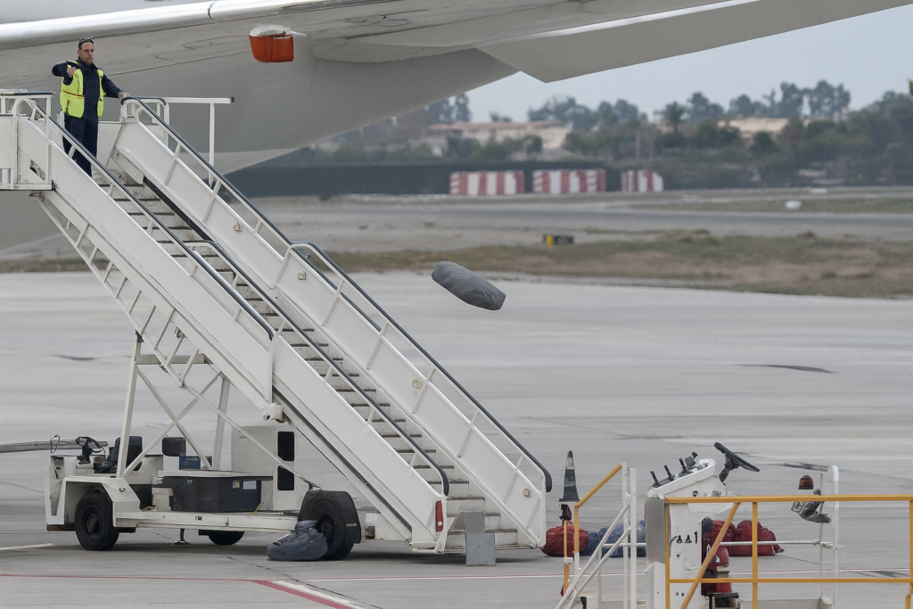 A viral video of an airport worker tossing items from a Qatar Airways plane at Madrid Airport has raised questions over luggage handling