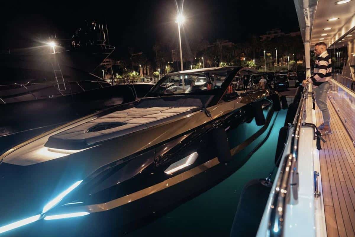 Conor McGregor looking at his Lamborghini yacht from the dock