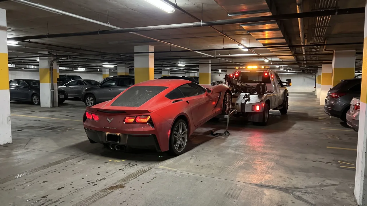Corvette owner learns a painful lesson about missed car payments after tow truck driver causes visible damage during repossession