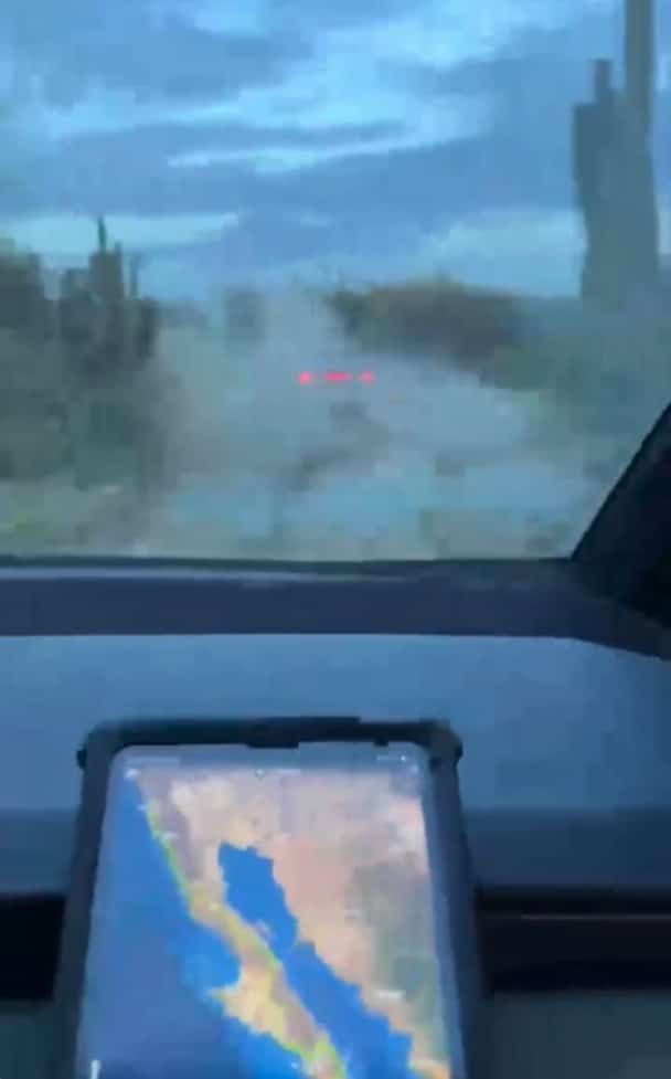 Cybertruck driving through mud in Baja