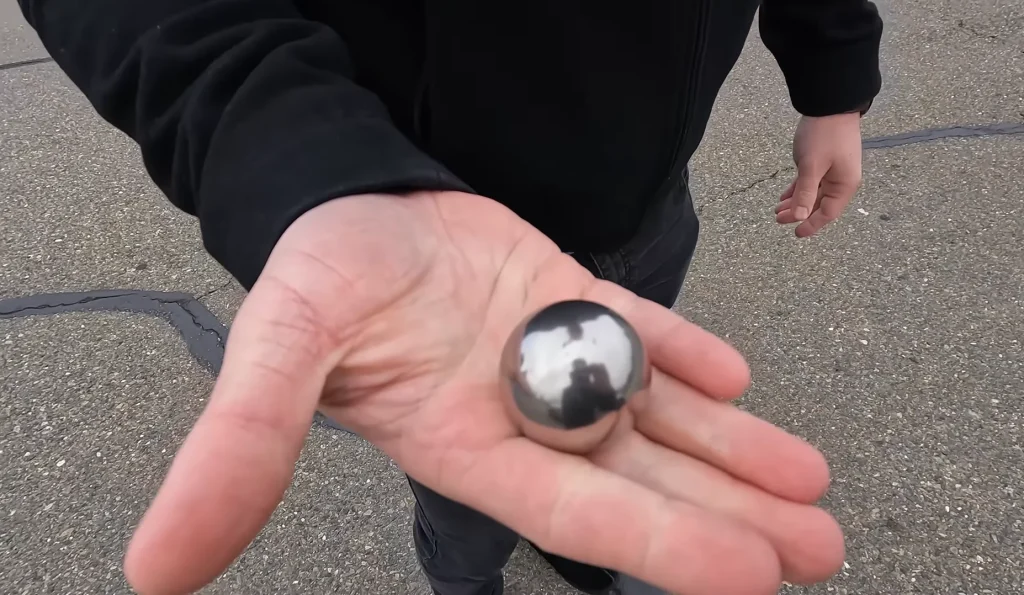 Man tests what happens if you throw a steel ball at a Tesla Cybertruck window after the infamous 2019 fail
