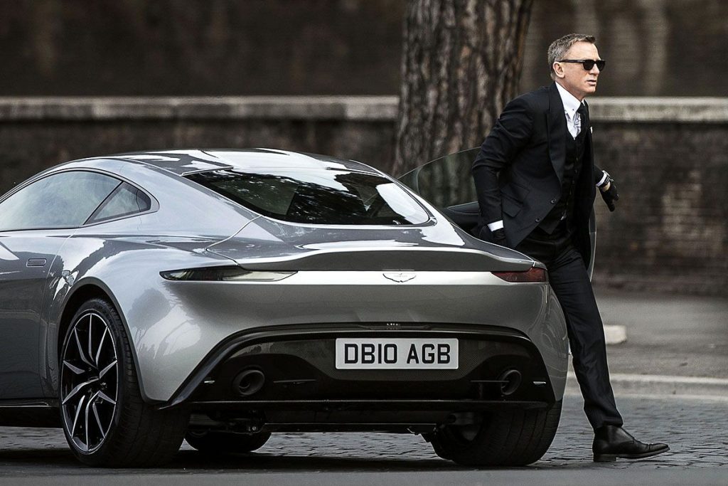 Daniel Craig as James Bond exiting the Aston Martin DB5.