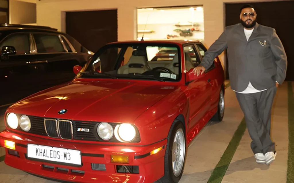 Celebrating his 50th birthday with a nostalgic touch, DJ Khaled was gifted a red 1991 BMW M3 by Jay-Z and Lenny S, after he lost his original model in a fire