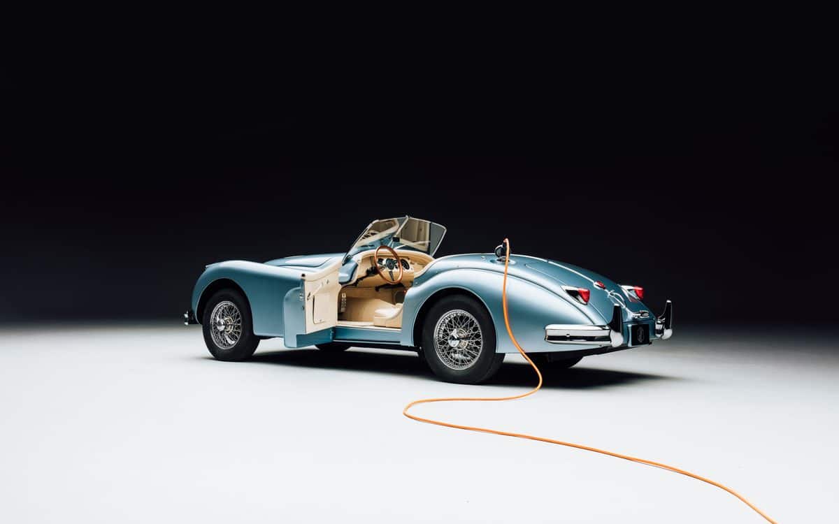 The XK140 with the door open and plugged into an energy source.