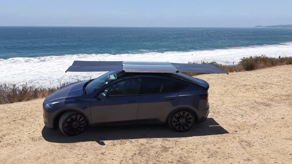 California company unveils worlds first solar roof system that can be installed on a Tesla or any other EV so you 'never have to stop at a charger again