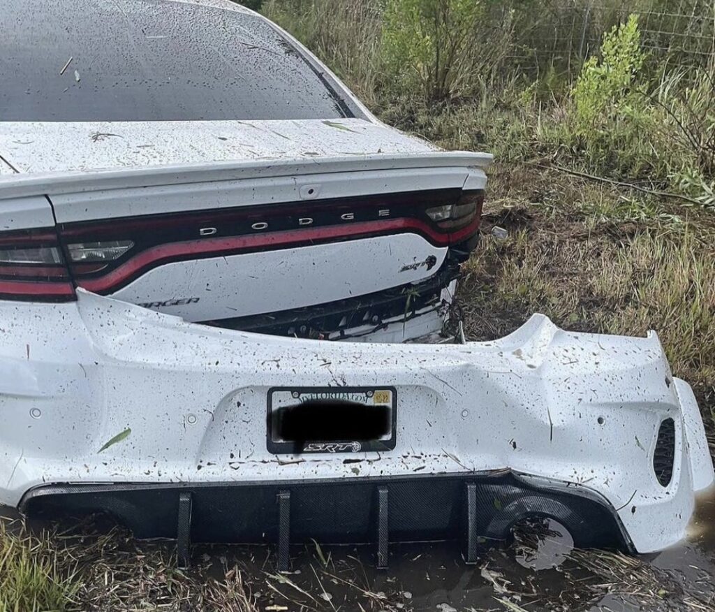 Dodge Charger in a swamp, damaged bumper