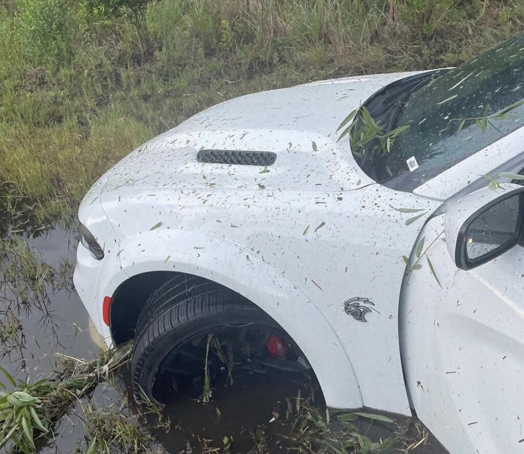 Dodge Charger in a swamp, front end damage