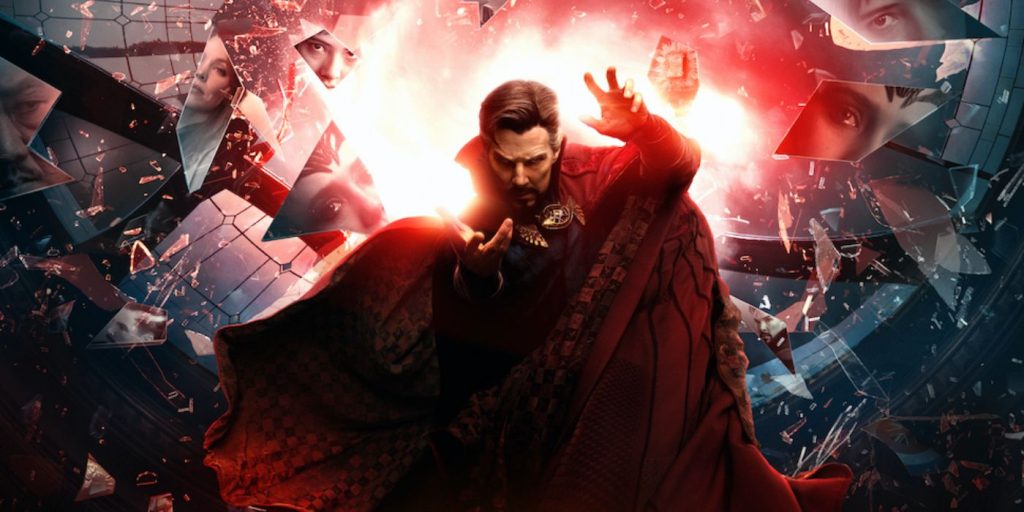 Stephen Strange as played by Benedict Cumberbatch appears in a promotional photo with shards of glass coming from behind him.