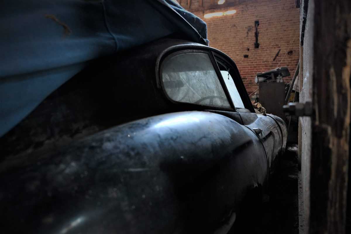 The E-Type Jaguar was hiding from view inside a dusty shed.
