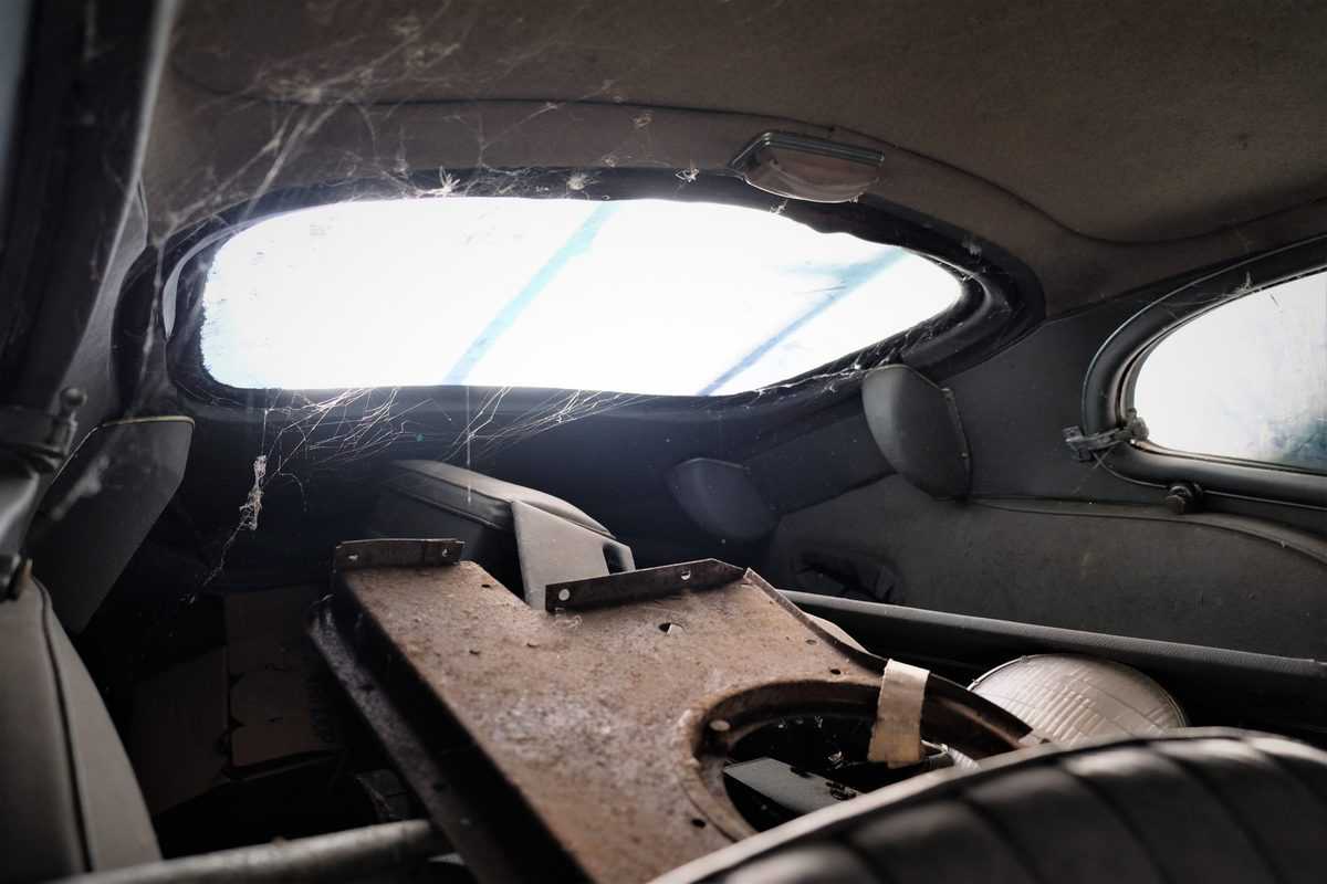 The rear of the Jaguar E-Type's interior was covered in cobwebs.