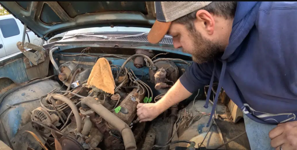 Dodge truck stuck between trees rescued by eager motor fans