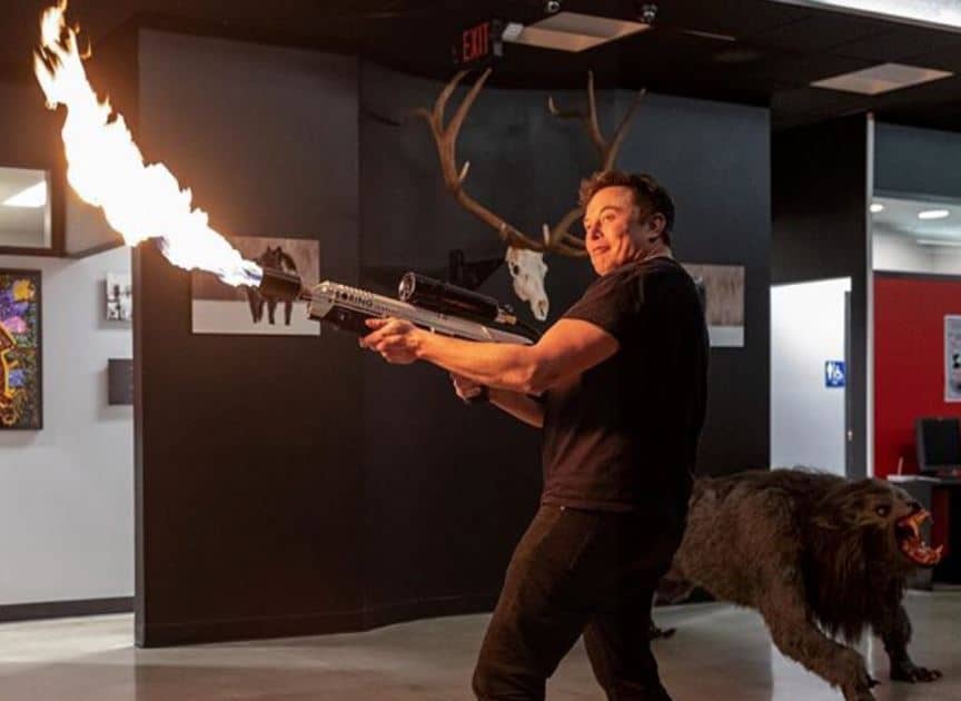 Tesla CEO Elon Musk uses a flame thrower