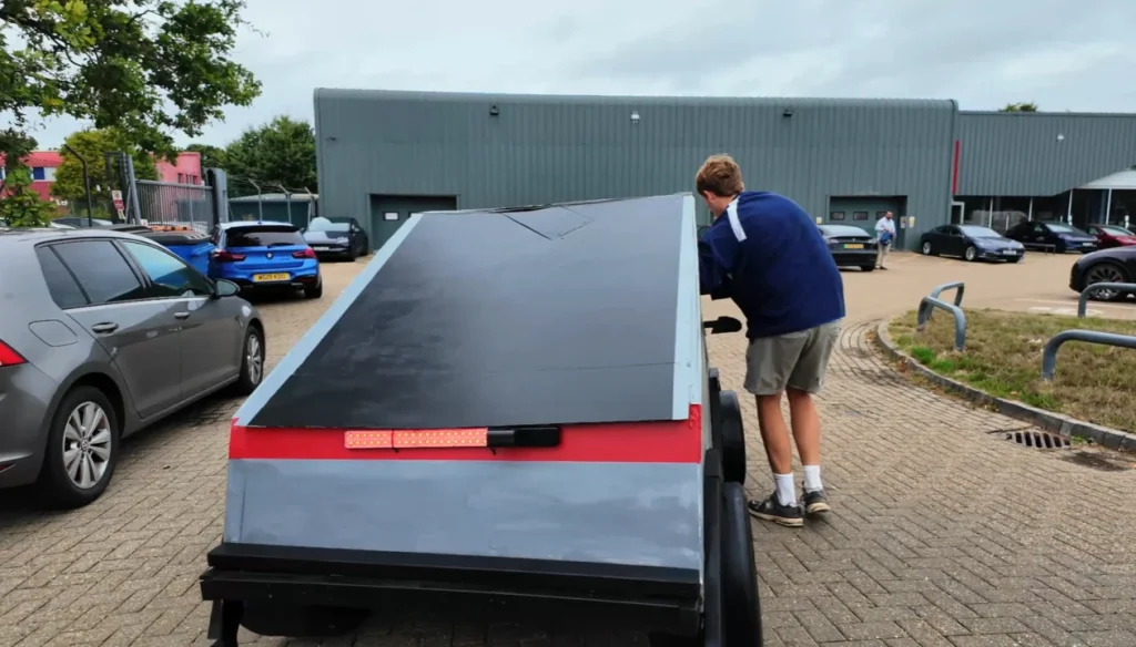 Man built a fake Cybertruck and slept in it outside Tesla dealership before staff came out and delivered their verdict on the car