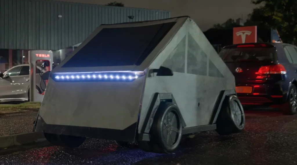 Man built a fake Cybertruck and slept in it outside Tesla dealership before staff came out and delivered their verdict on the car