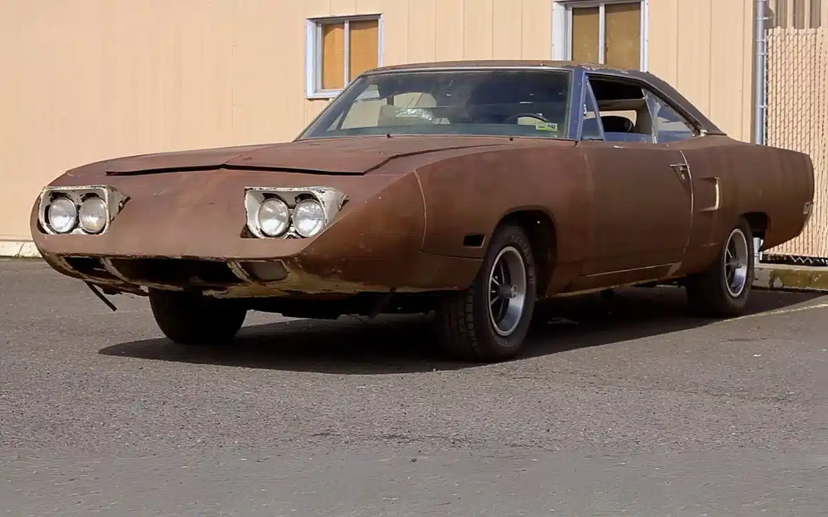 Father and son wait decades for Plymouth Superbird after hearing urban legend a scary man in town had one